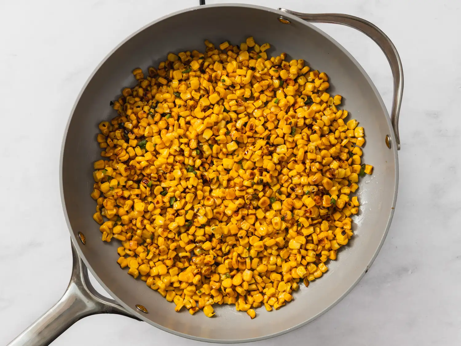 Corn being cooked in a pan