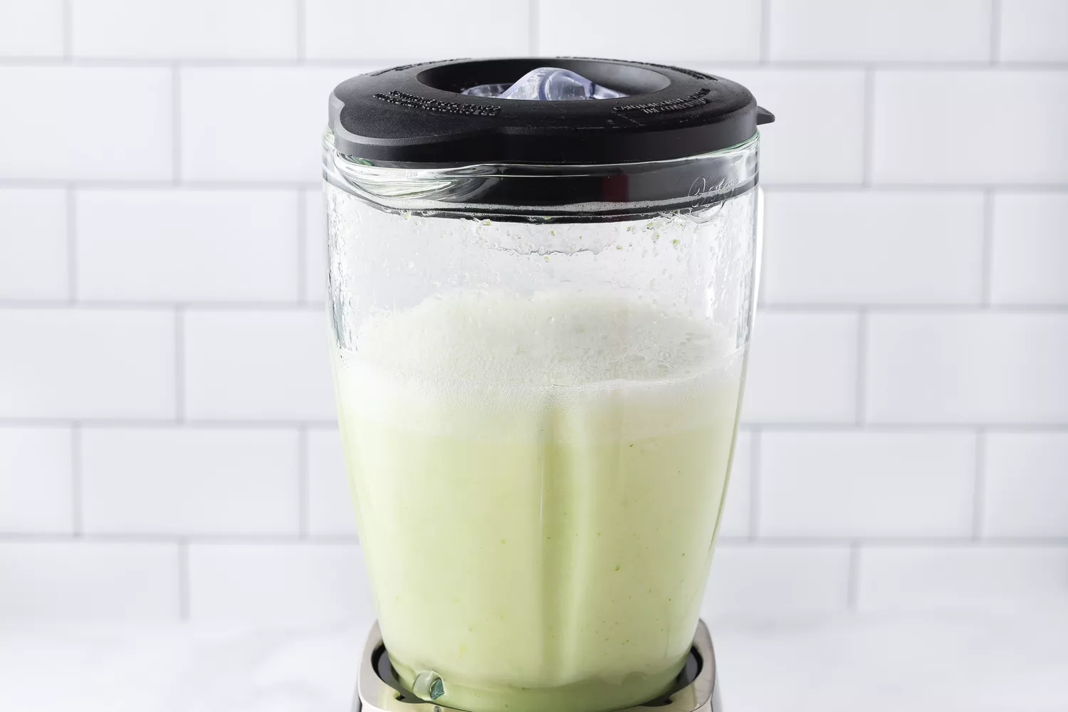 Blended lime and water in a blender.