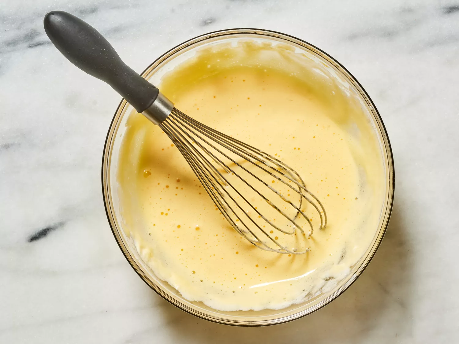 egg whites beaten in a bowl