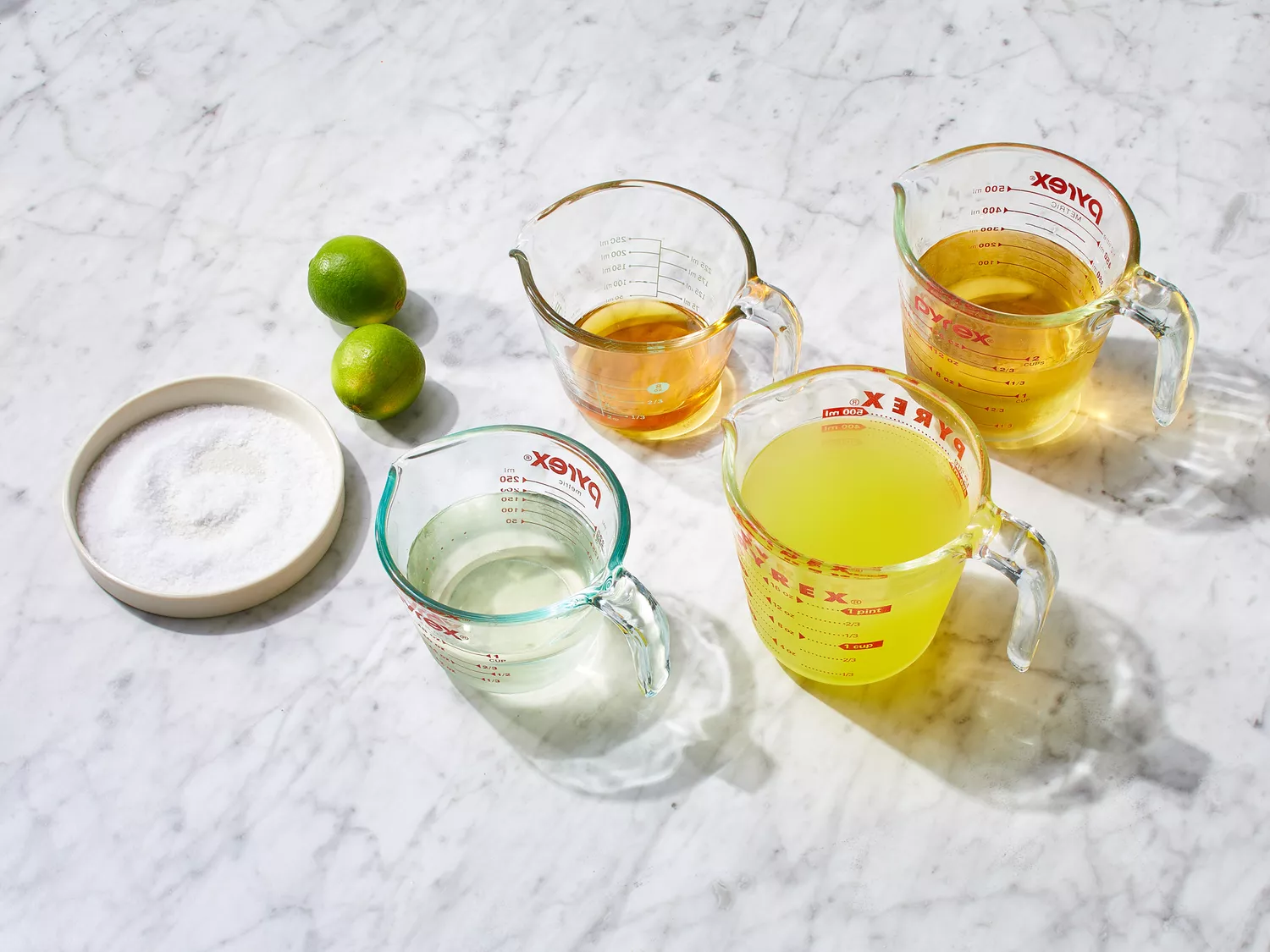 ingredients gathered to make margaritas on the rocks