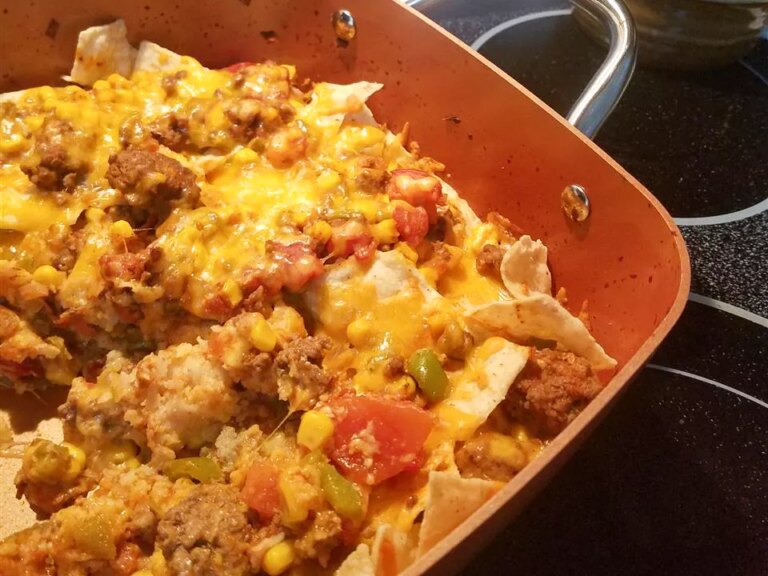 Close up view of a taco bake in a baking dish on a stove top