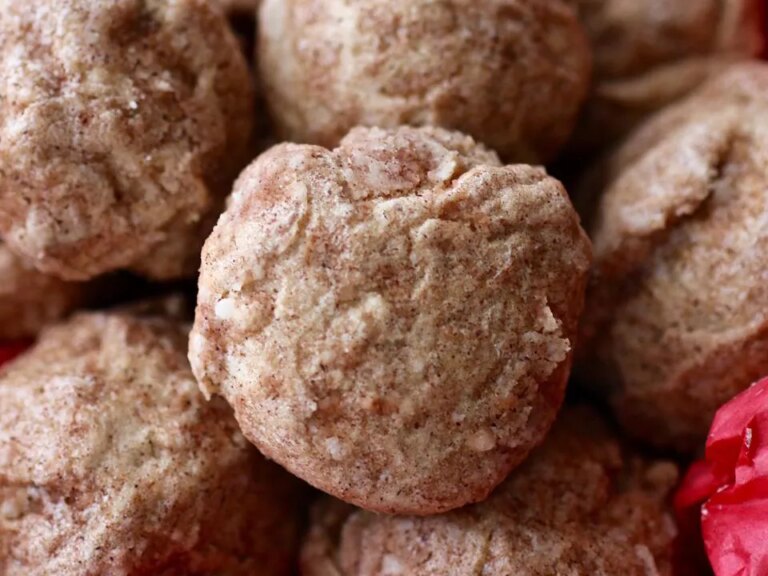 Close up view of a pile of polvorones de canele (cinnamon cookies)