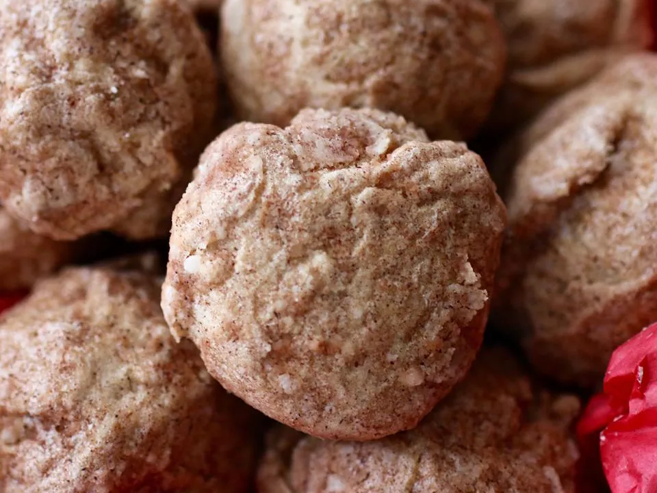 Close up view of a pile of polvorones de canele (cinnamon cookies)