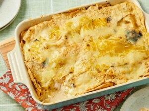 Green chile chicken enchilada casserole in a baking dish