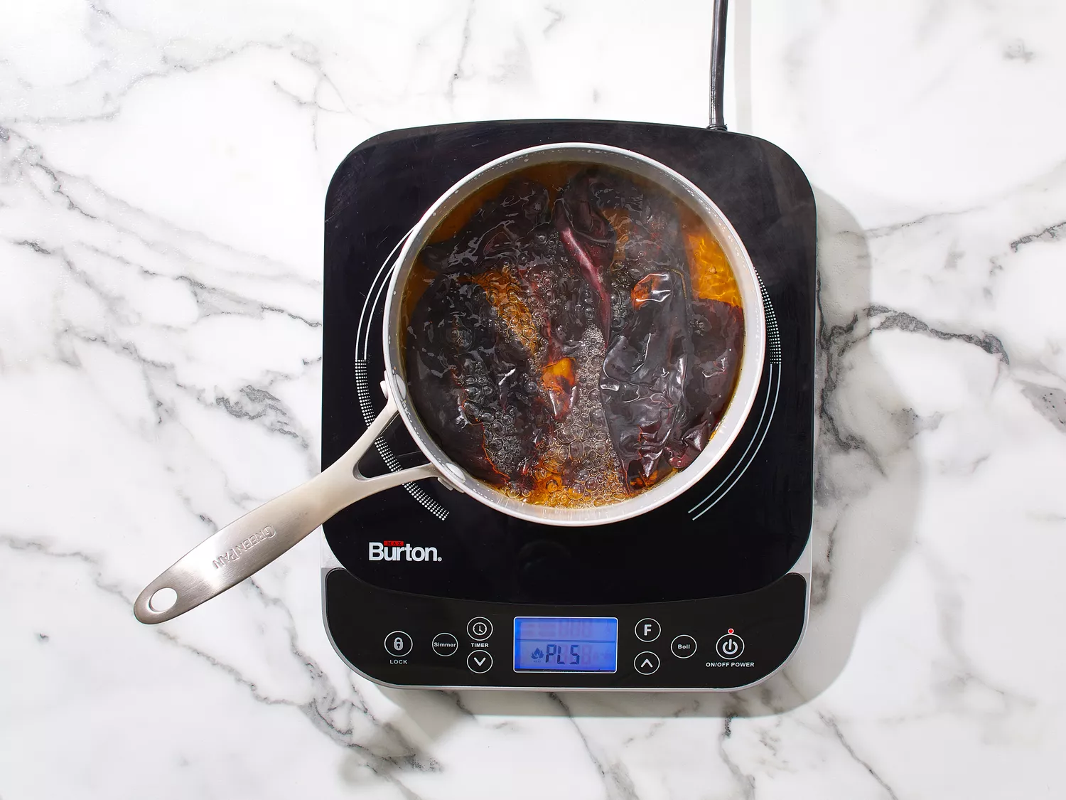 Chiles softening in a saucepan of boiling water.