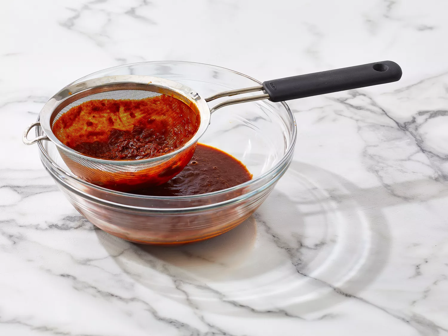 Sauce placed through a fine mesh strainer. 