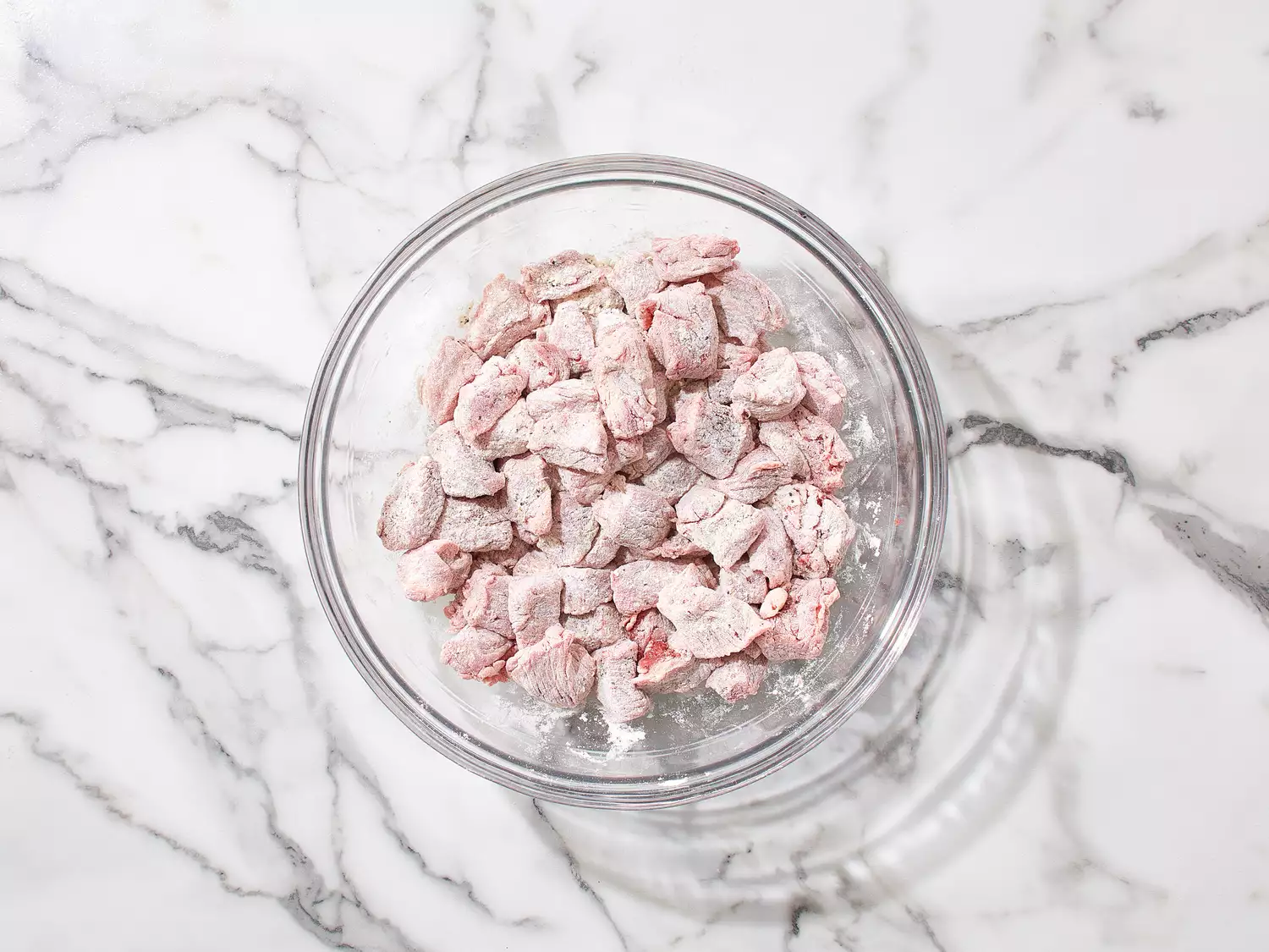 Beef cut into chunks and dredged in flour and seasonings.