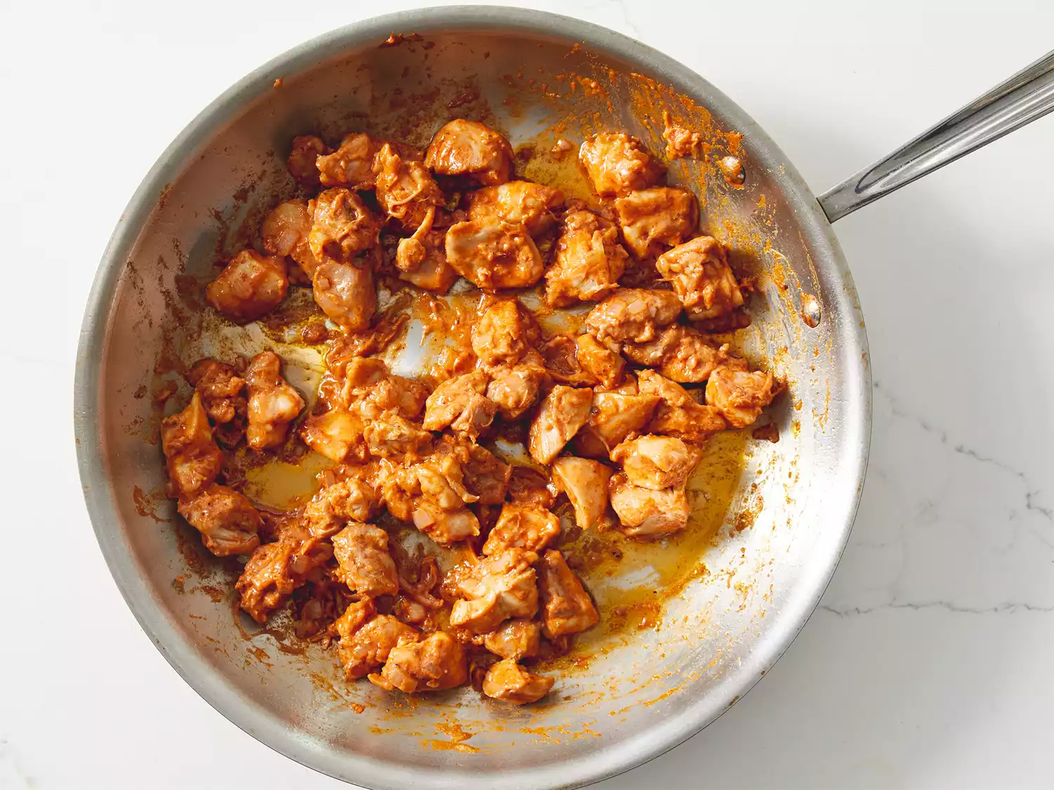 Chicken mixed in with sauce.