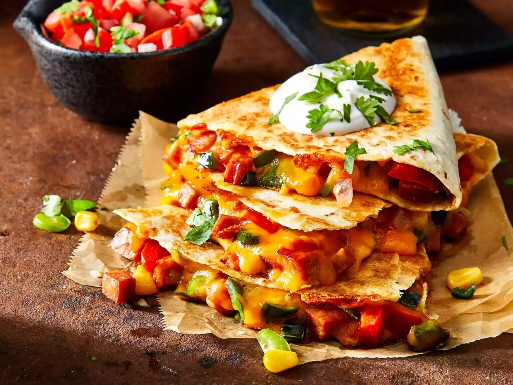 Mid angle looking at a few andouille and poblano quesadillas