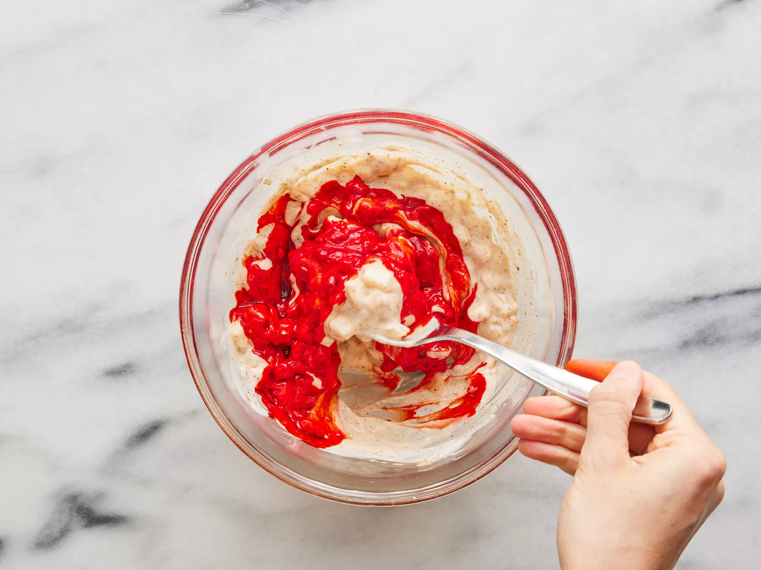 yogurt mixture ingredients being combined in a small bowl.