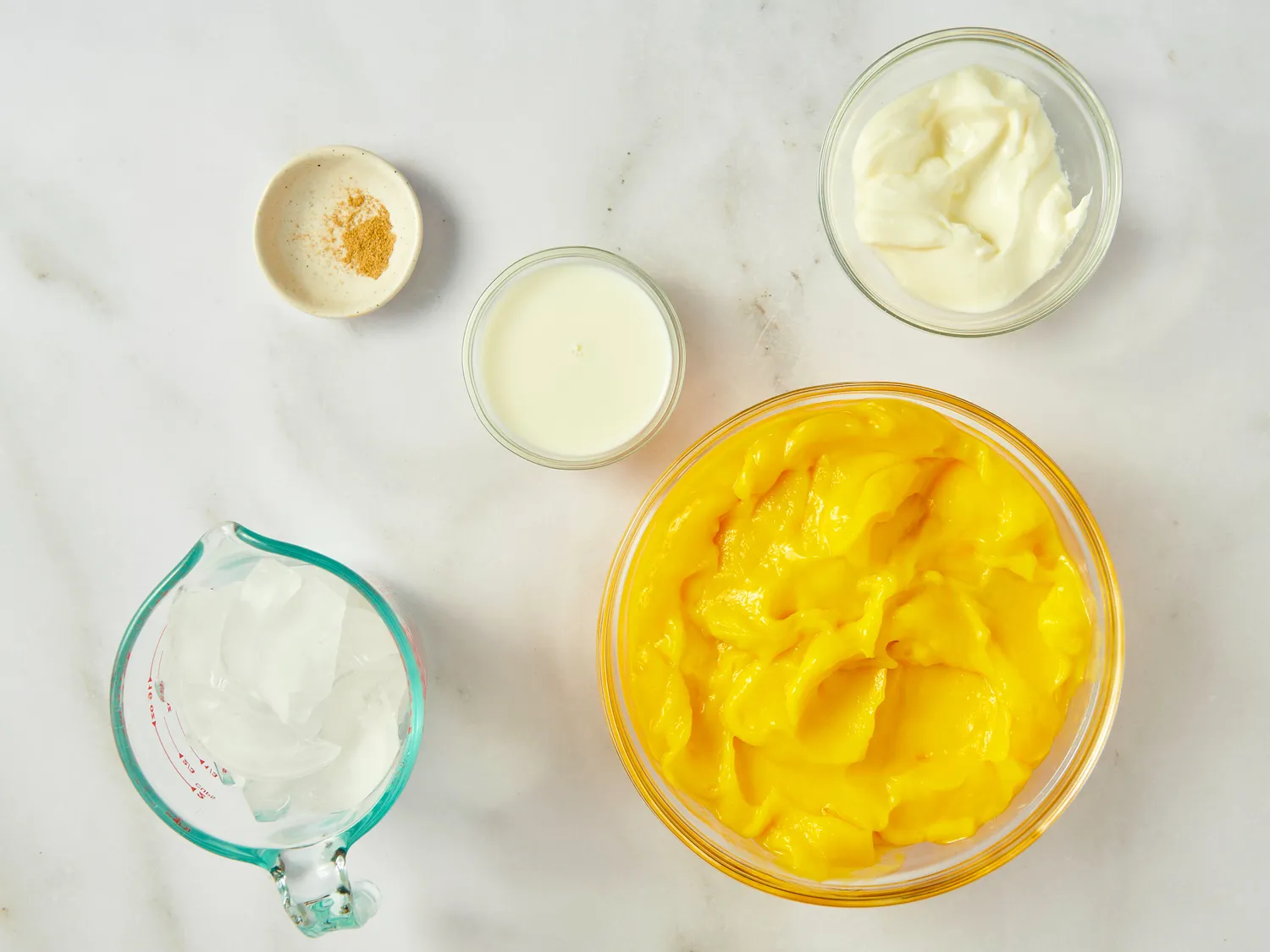 Ingredients for mango lassi on a table