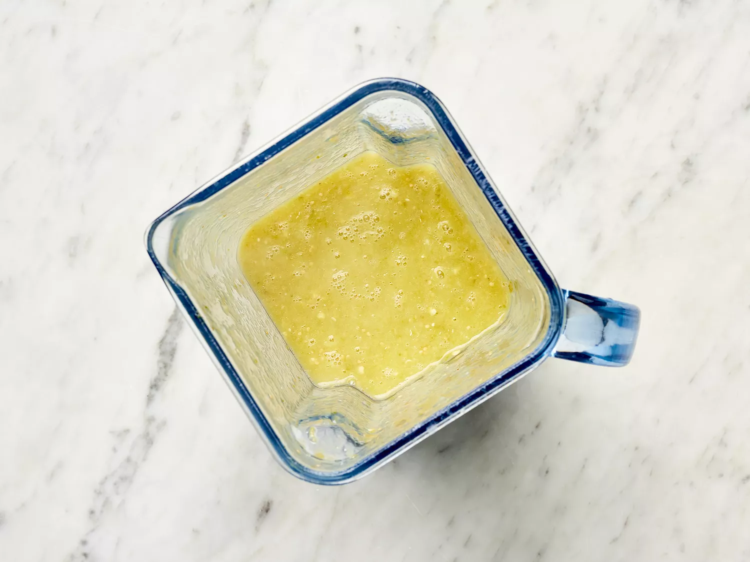 Green salsa in a blender 