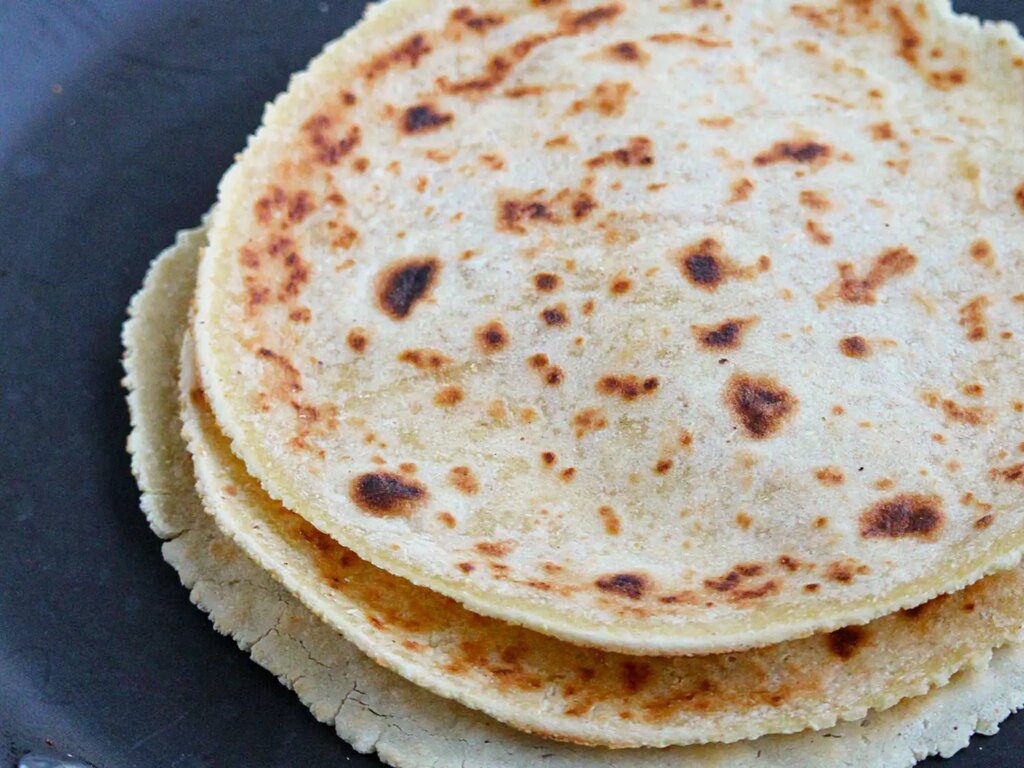 Close up view of a stack of cassava flour tortillas on a platter