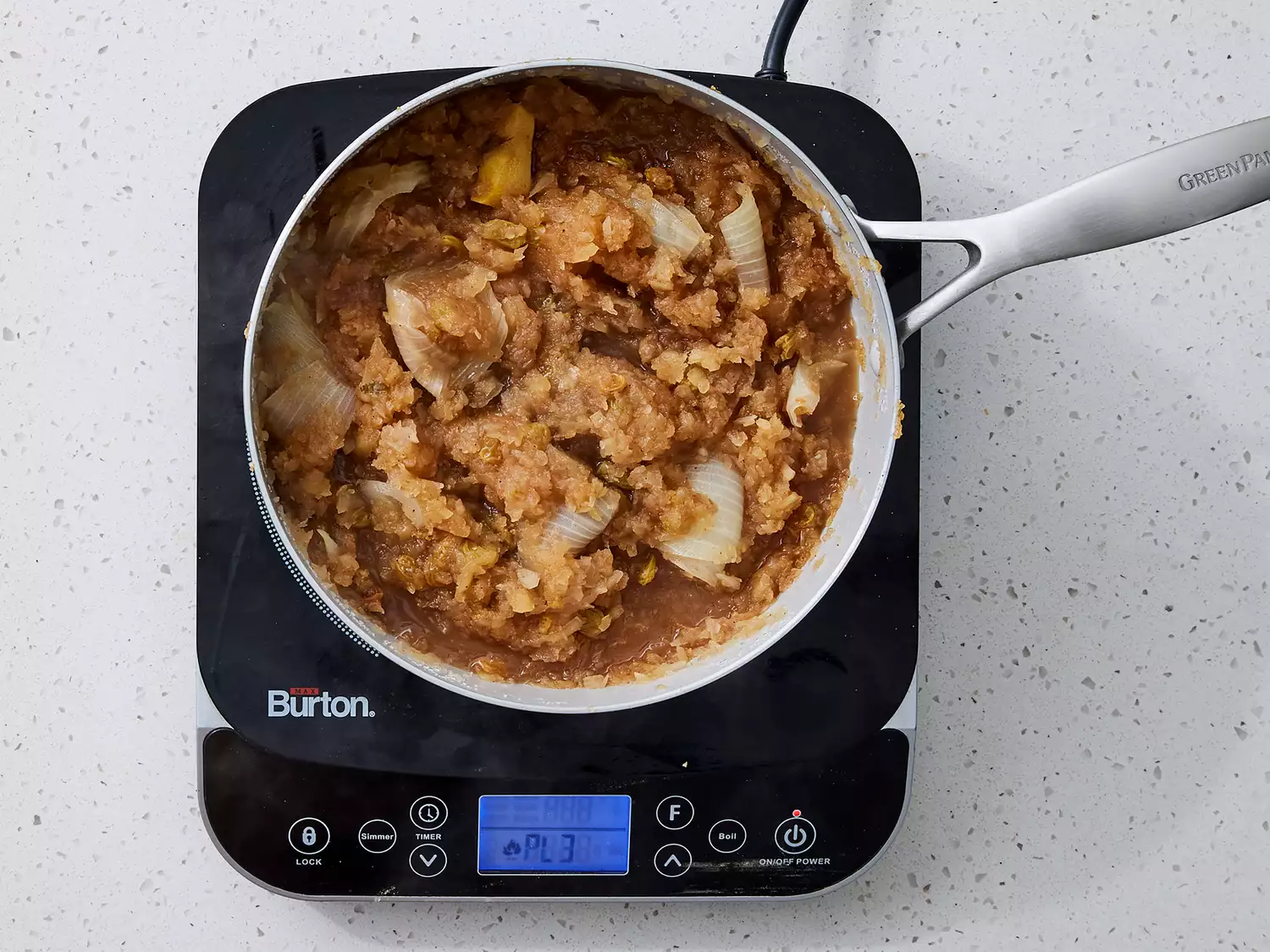 apples, onion, ginger, vinegar, white sugar, brown sugar, cinnamon, white pepper, cardamom, and nutmeg in a large saucepan cooked until tender.
