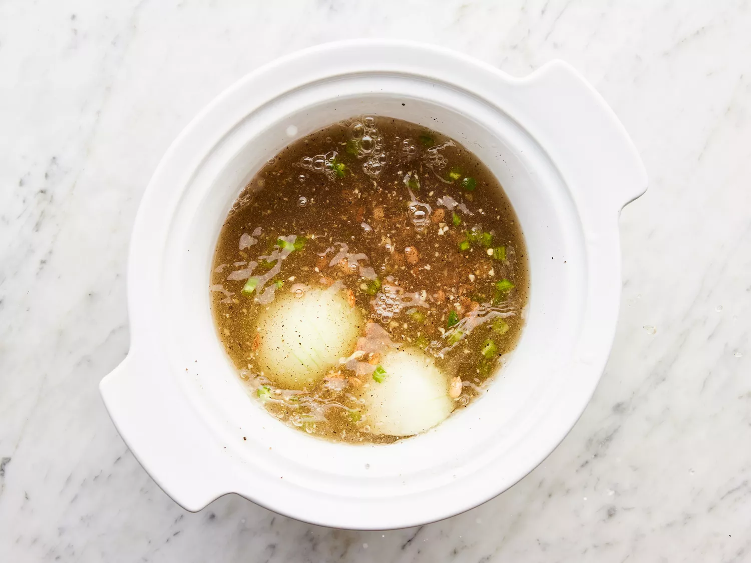 all ingredients placed in a slow cooker with water added, stirring to combine.