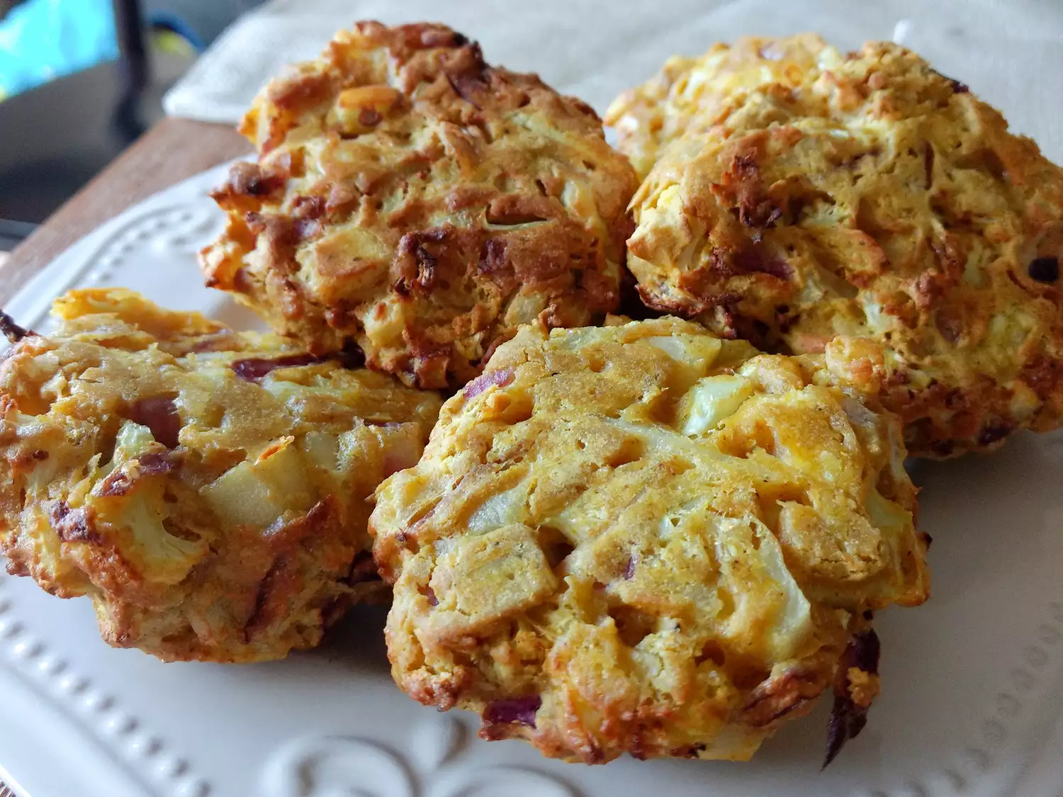 Close up view of air fryer pakoras on a white platter