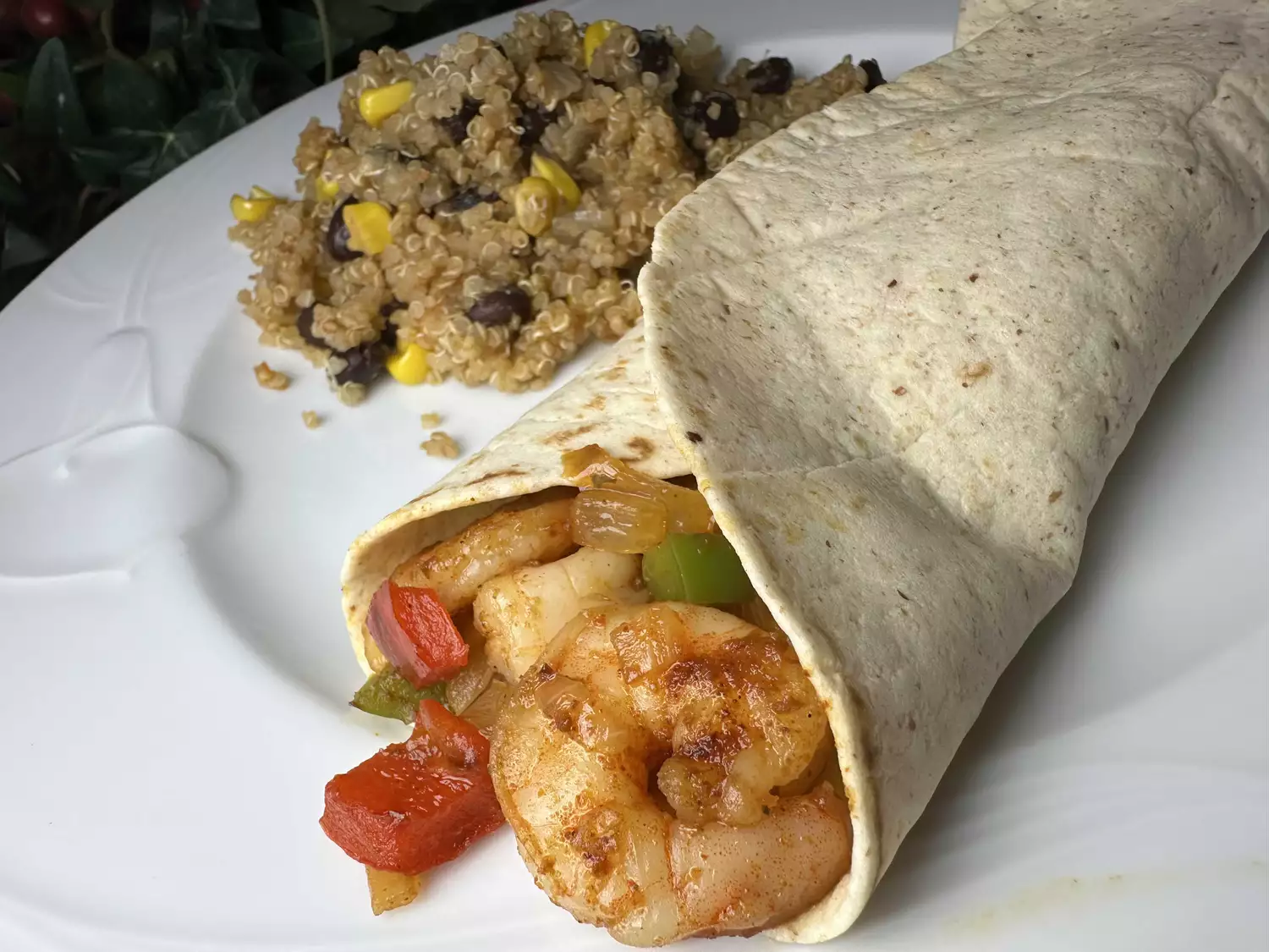 Shrimp fajitas in tortilla with rice on the side