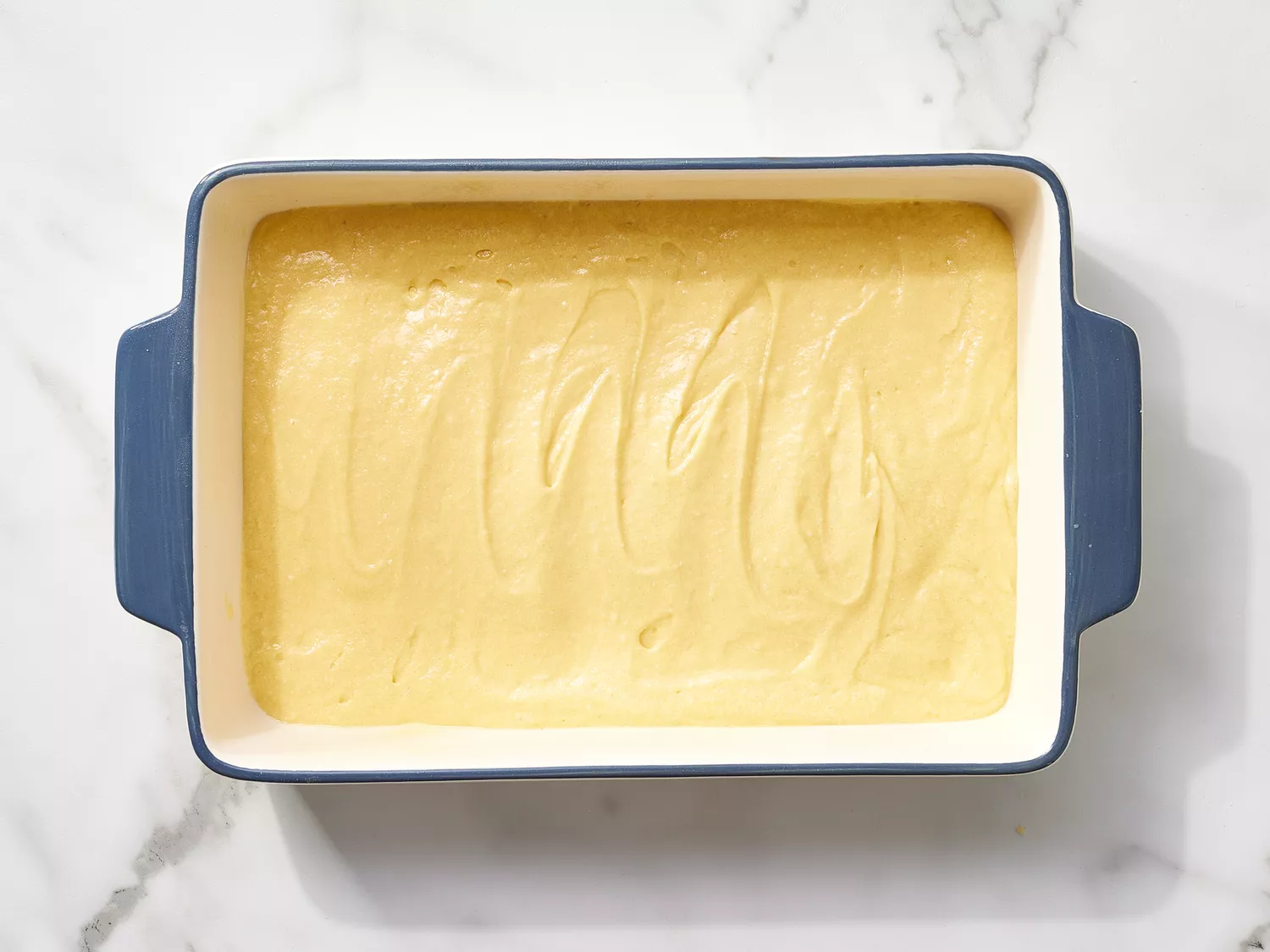 Cake batter in a baking dish 