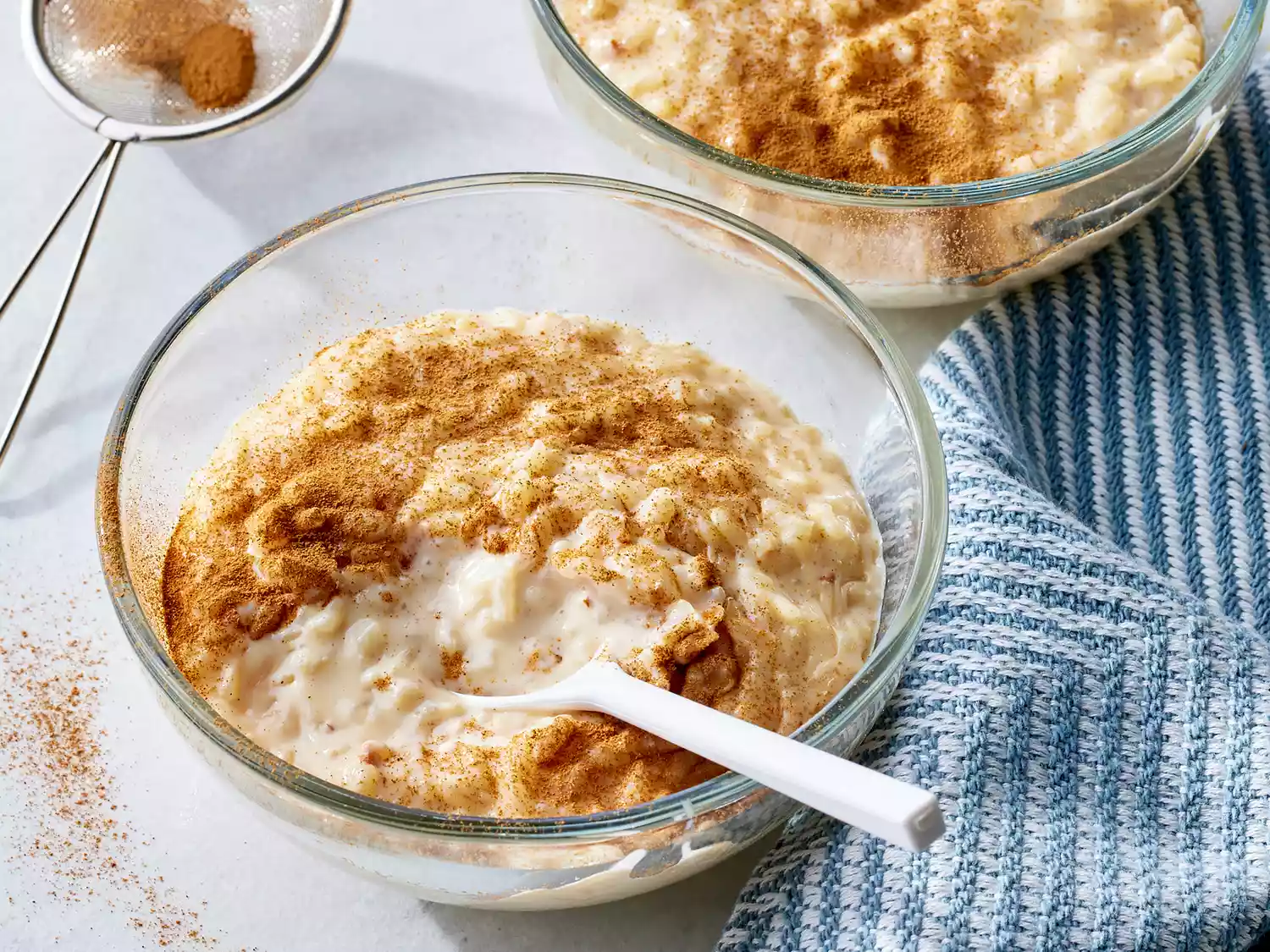 A high angle view looking into a bowl of creamy arroz con leche.