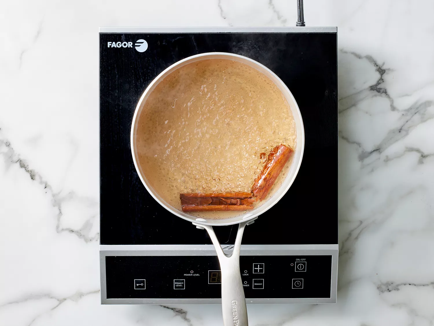 two cinnamon sticks in boiling water. 