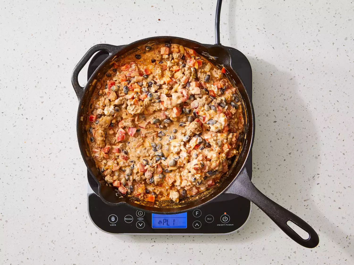 sour cream and black beans stirred into ground beef and pepper mixture.