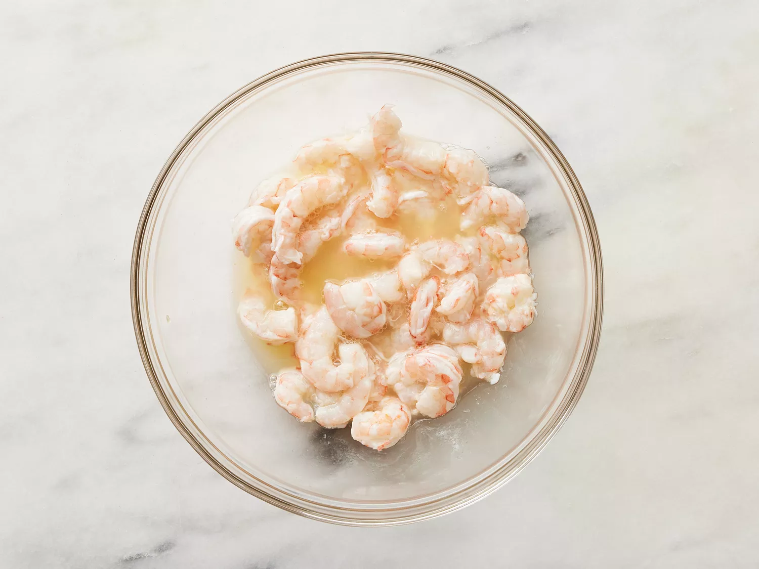 Shrimp sitting in a bowl of lemon juice, until opaque. 