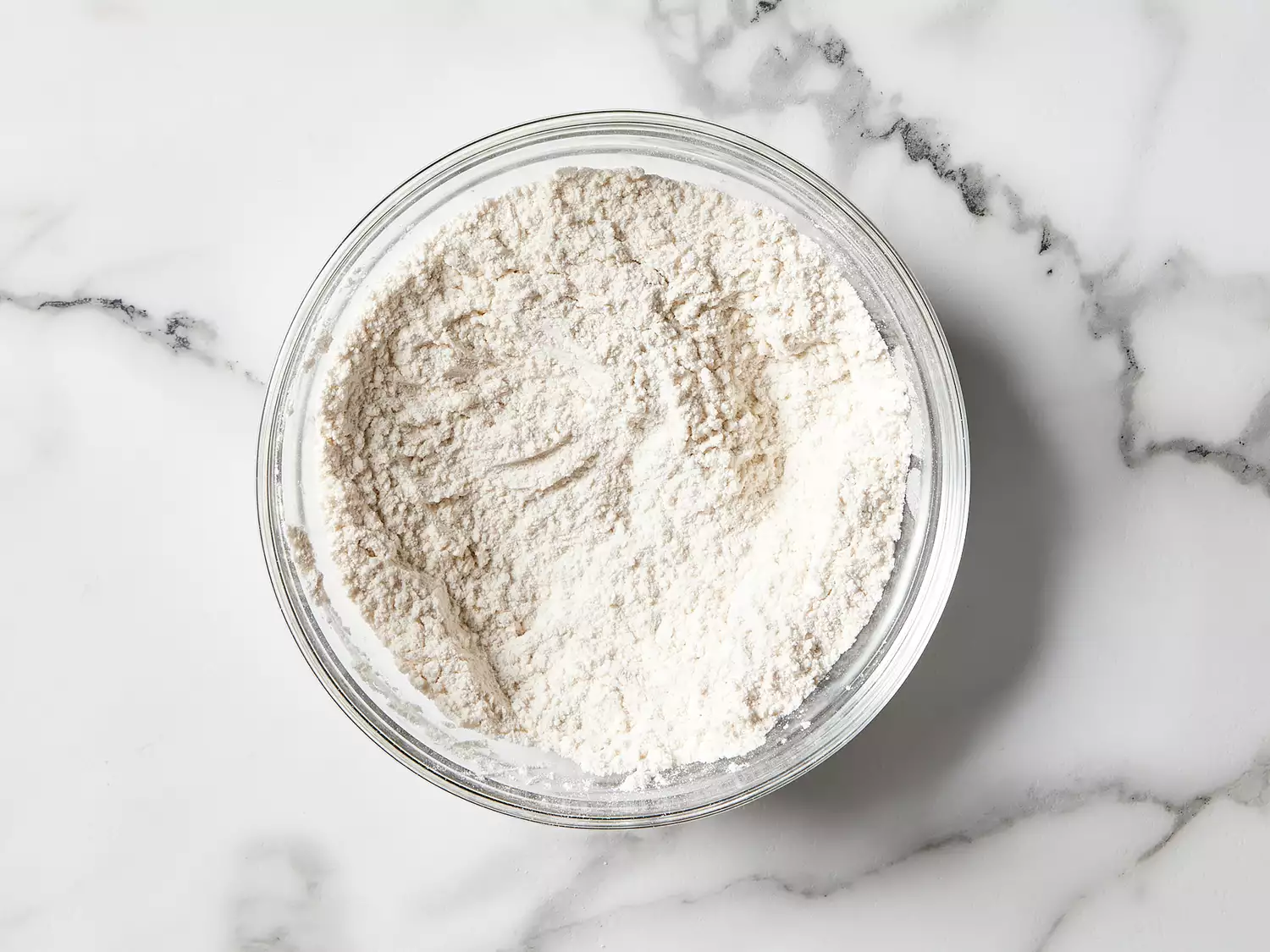flour and baking powder combined in a bowl 