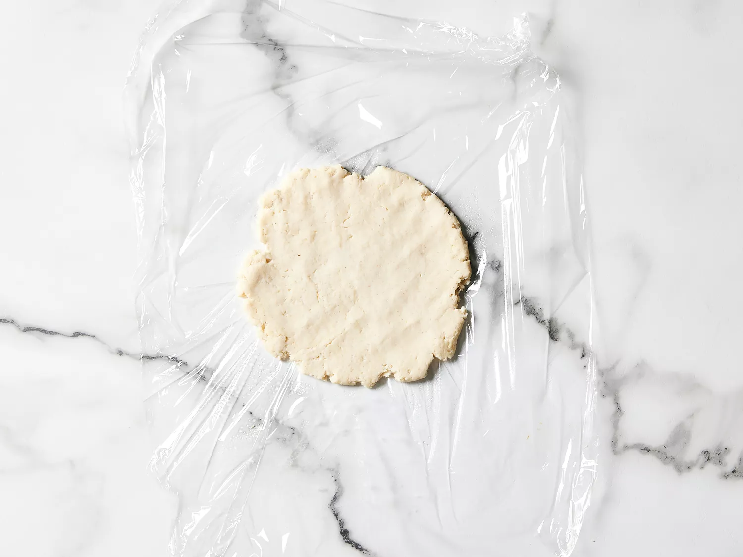 dough flattened out to a disc