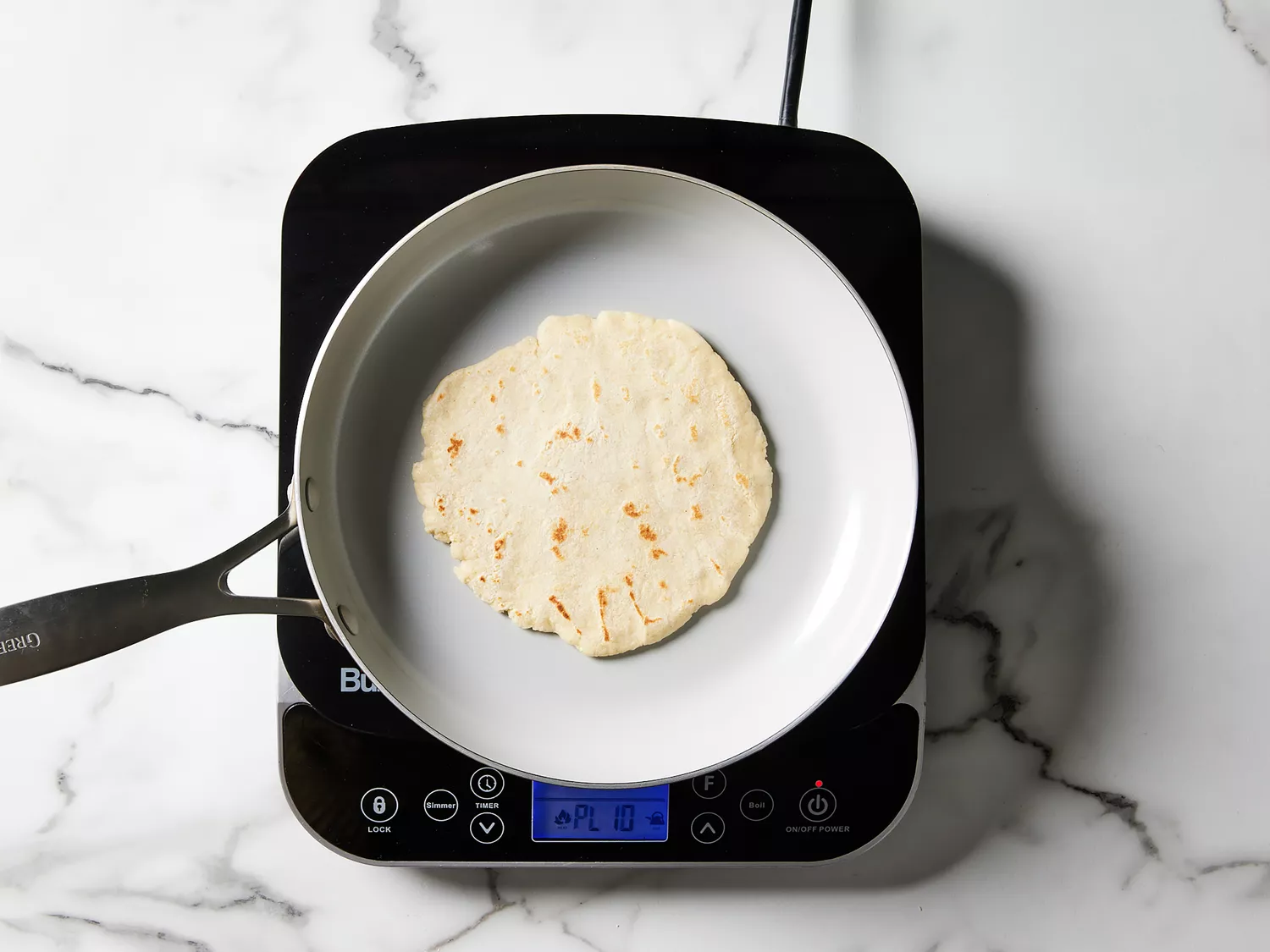 gorditas cooked in a skillet until dry and golden spots appear 
