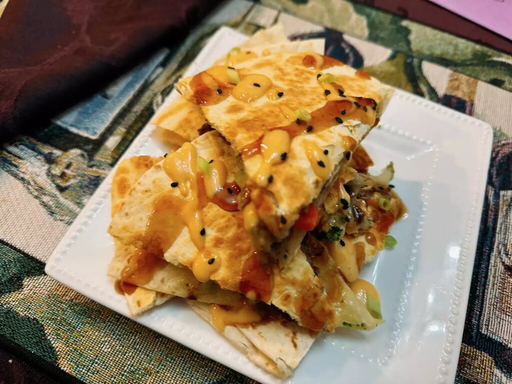 Quesadilla wedges on white platter