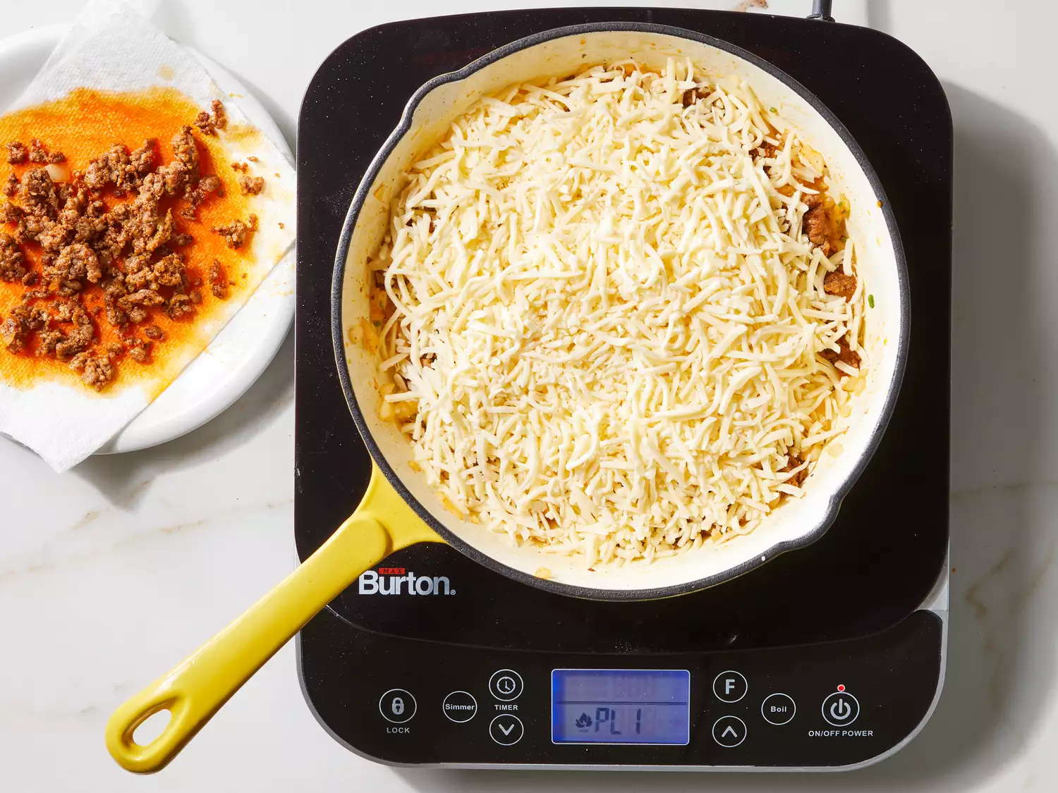  all but 2 tablespoons of the chorizo and Chihuahua cheese added to skillet