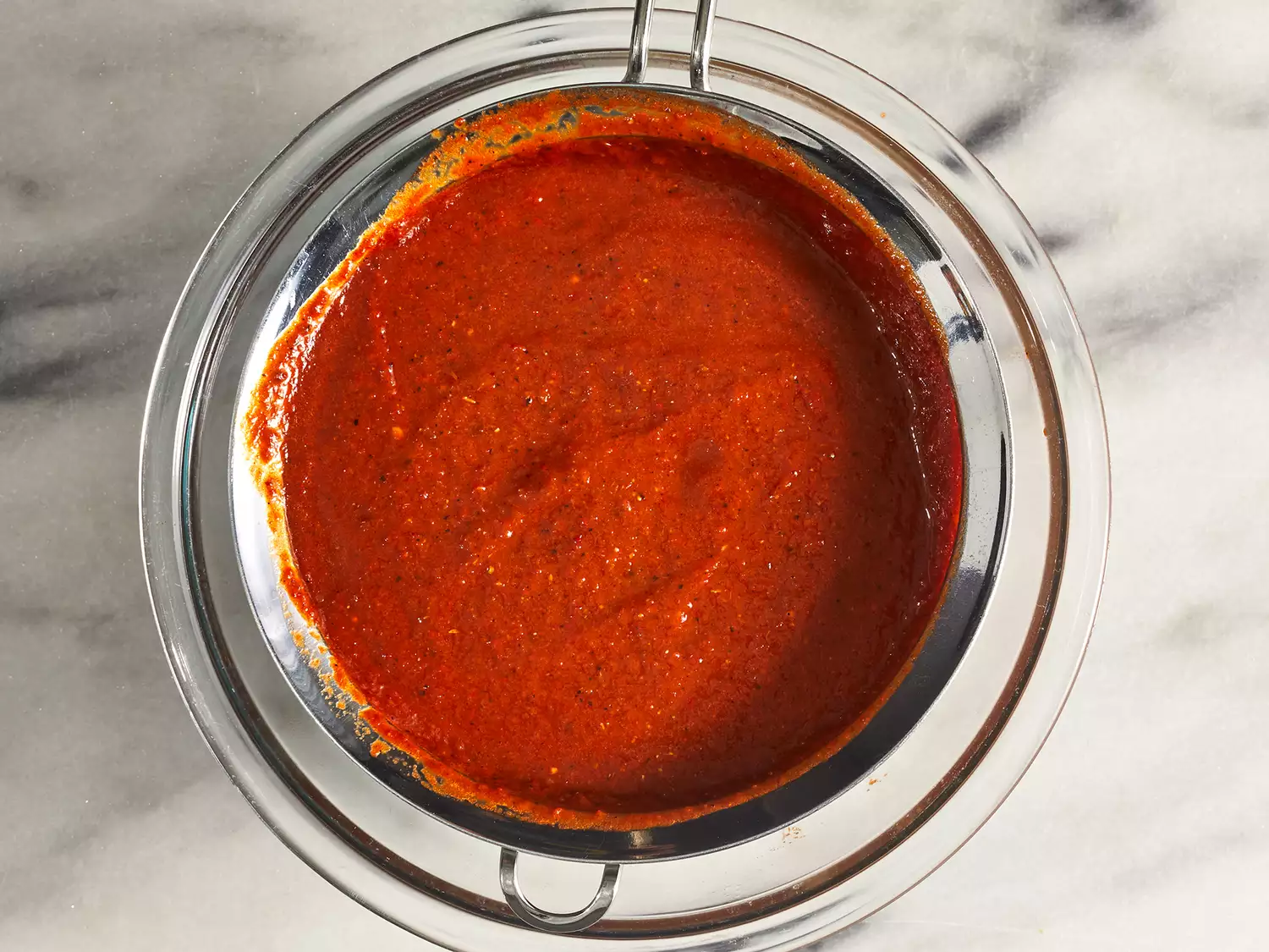 Pour mixture through a strainer and into a bowl.