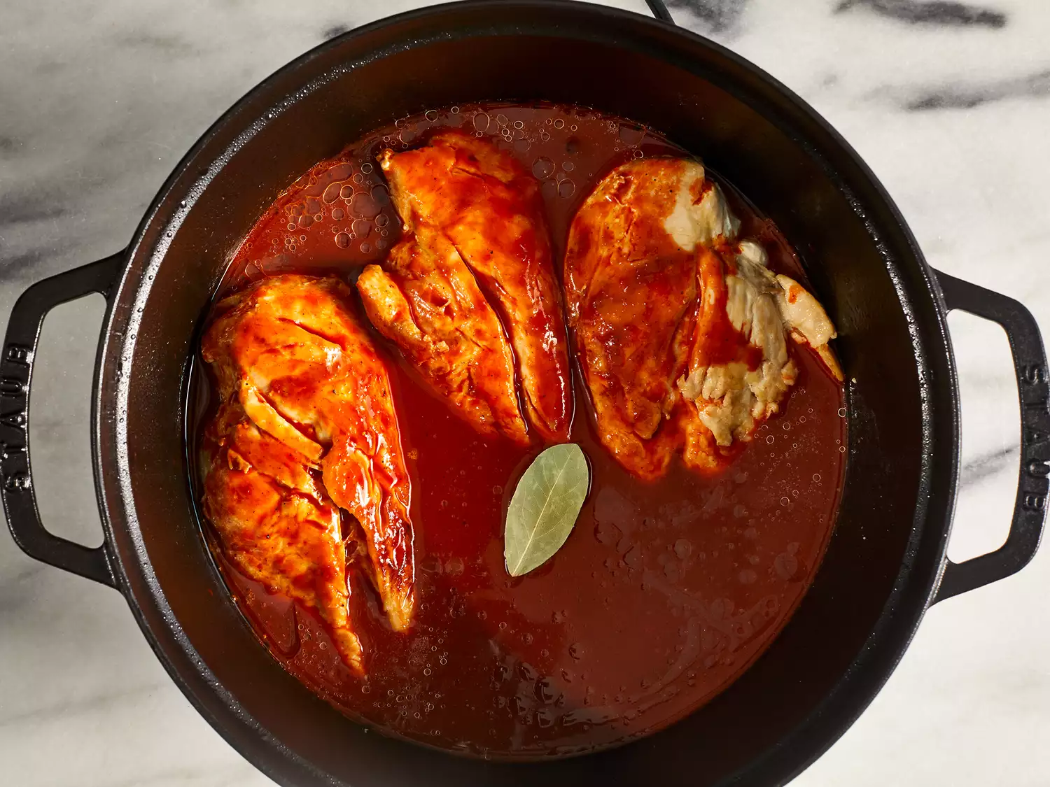 Pour chile mixture over chicken, cooking until chicken is throughly cooked.