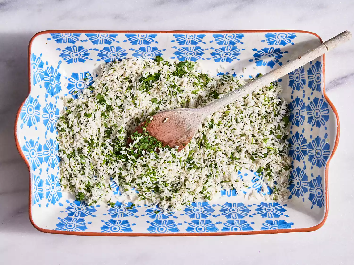 Add rice to baking dish and stir in cilantro, lime zest and lime juice, mixing until well combined.