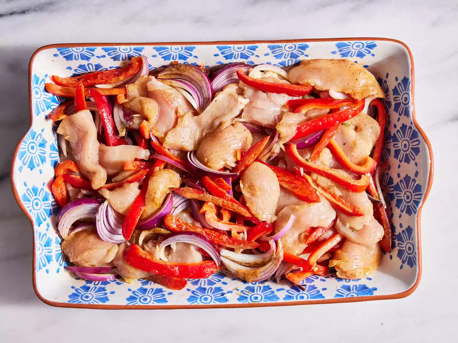Transfer fajita mixture to baking dish and evenly spread over rice mixture. 