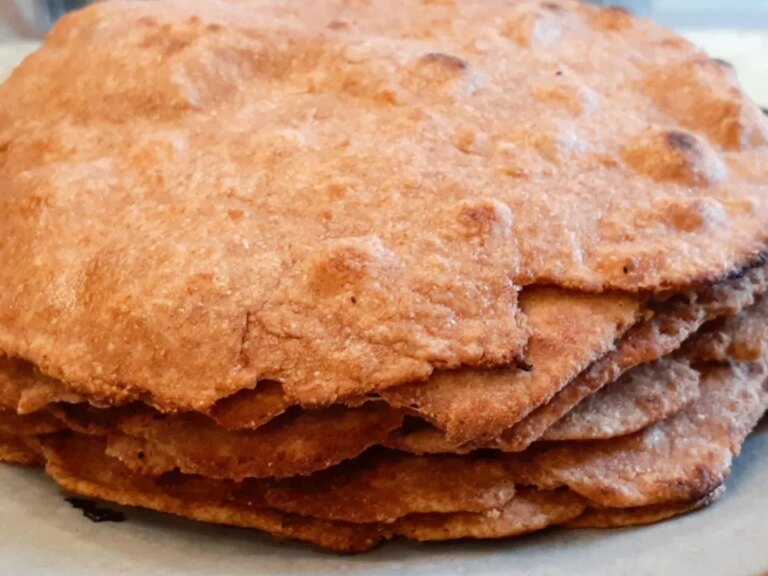Close up view of a pile of whole wheat chapati on a plate