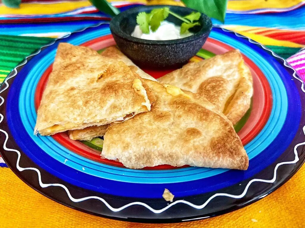 Quesadilla triangles on colorful plate