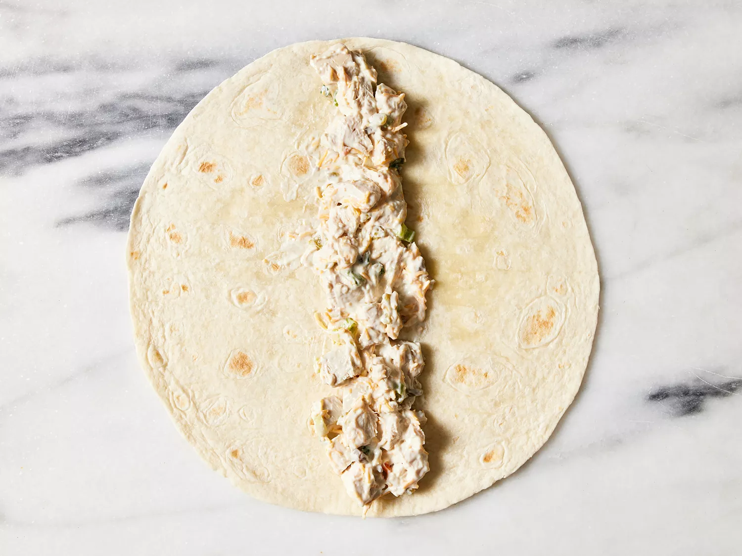 Flour tortilla filled with chicken mixture.