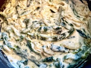 Closeup overhead view of rajas con crema, creamy poblano pepper strips