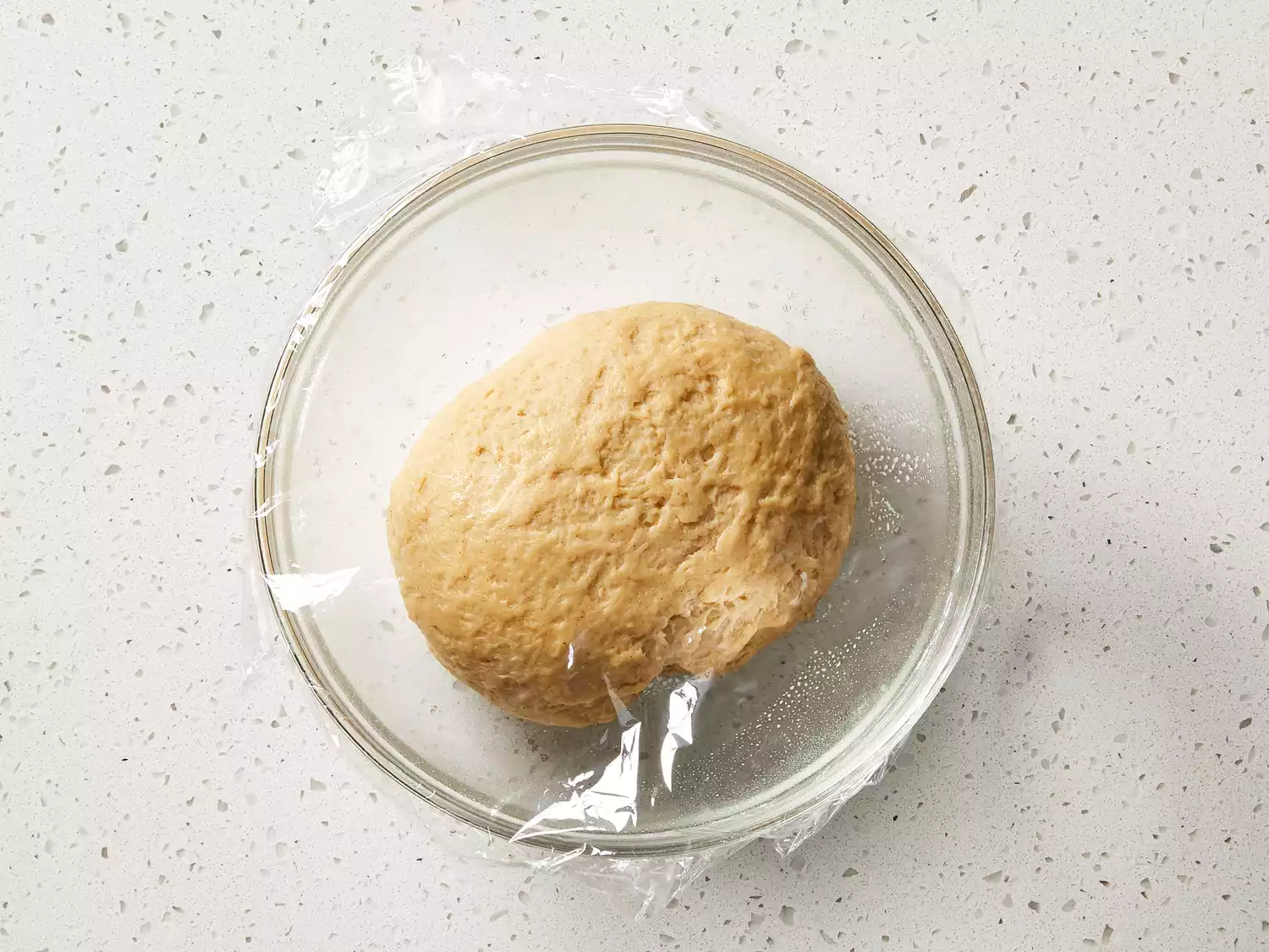 Dough covered and left to rise until doubled.