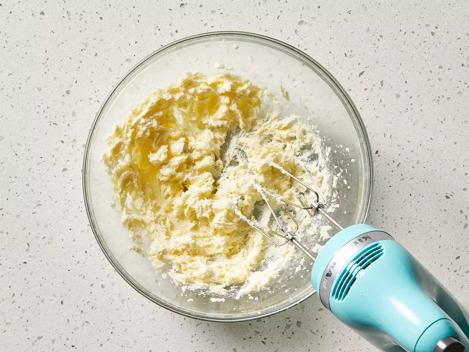 Sugar and butter beaten in a bowl until light and fluffy.