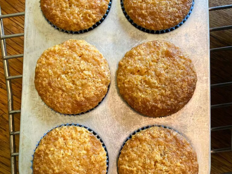 Close up view of mexican corn bread muffins in a muffin pan