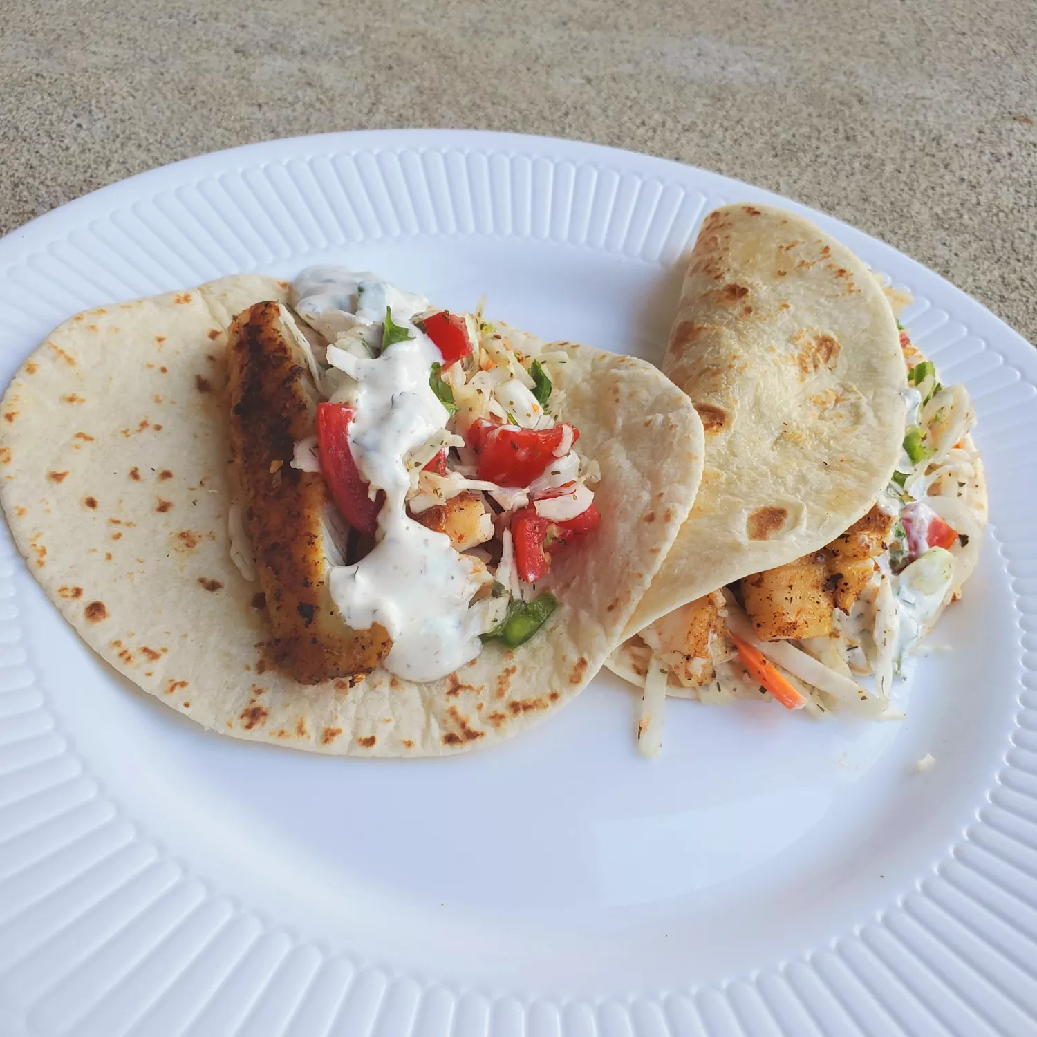 Fish tacos with cabbage salsa and yogurt sauce