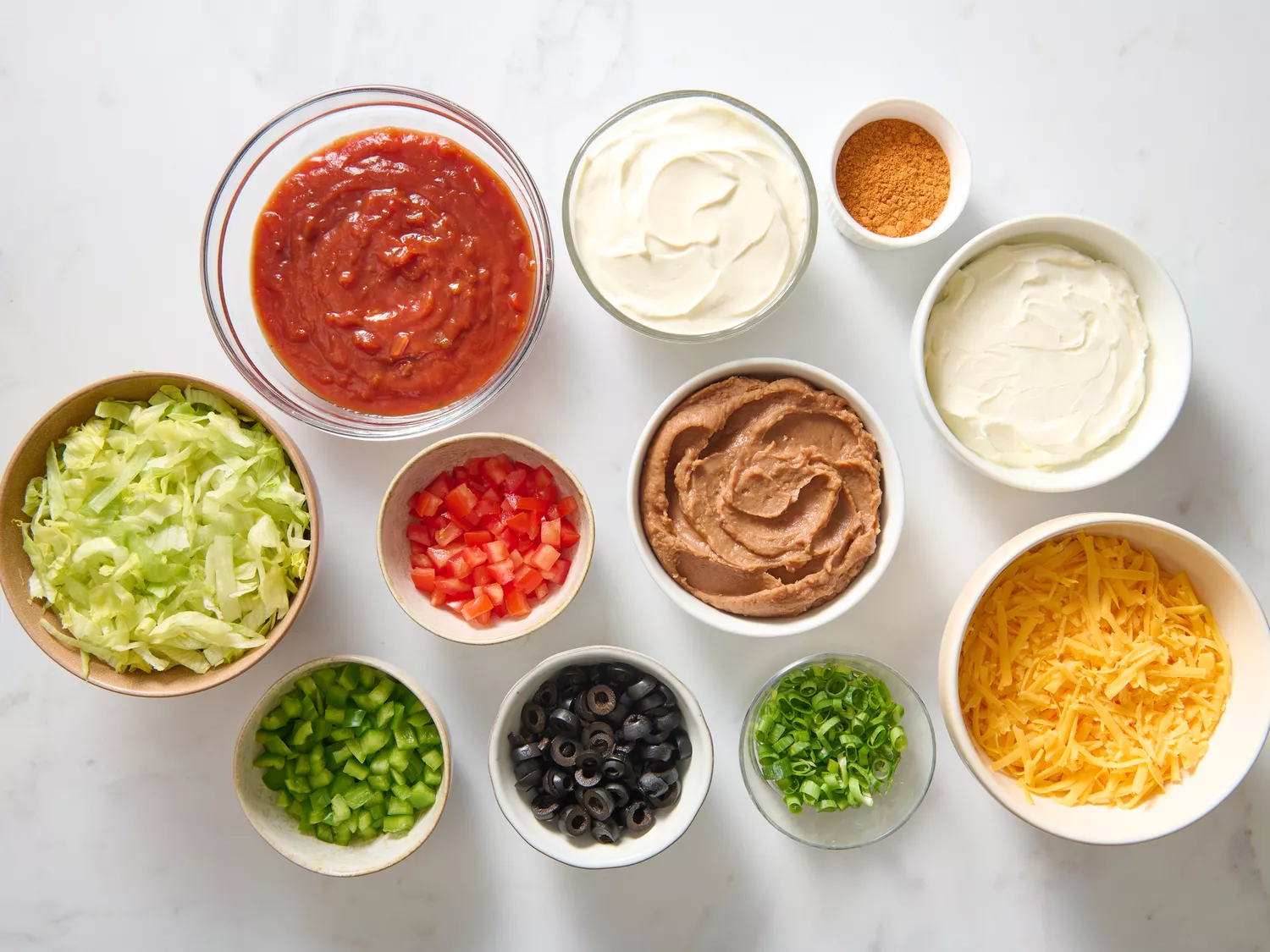 Ingredients to make seven layer taco dip