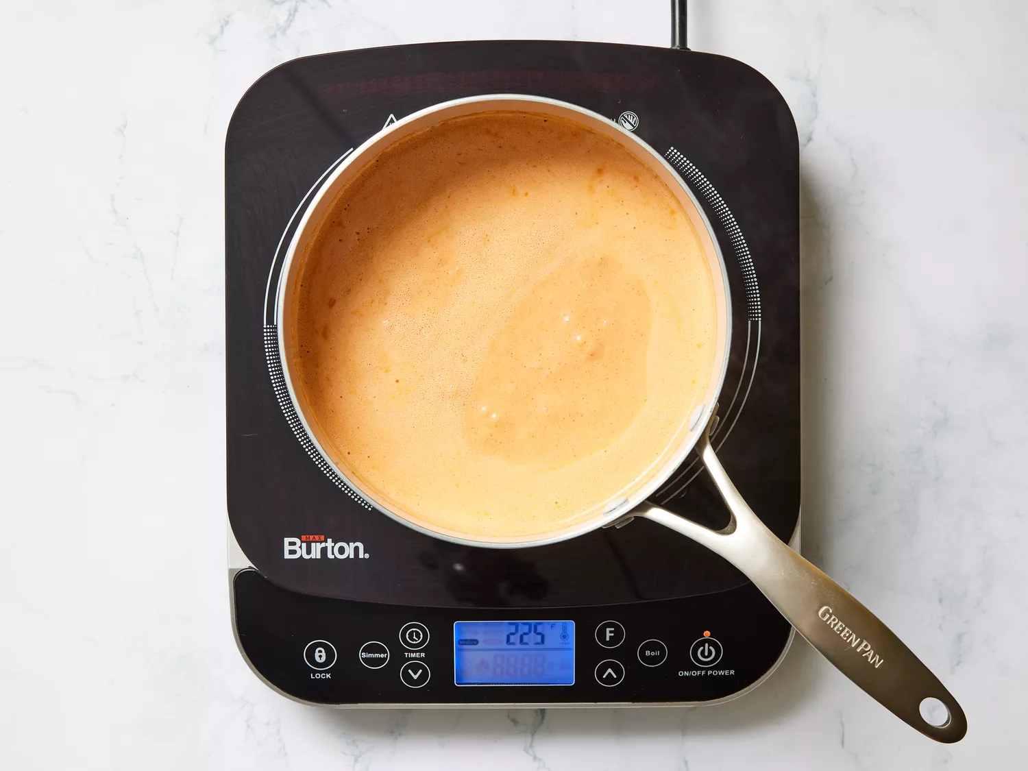 A small pot of seasoned creamy tomato sauce