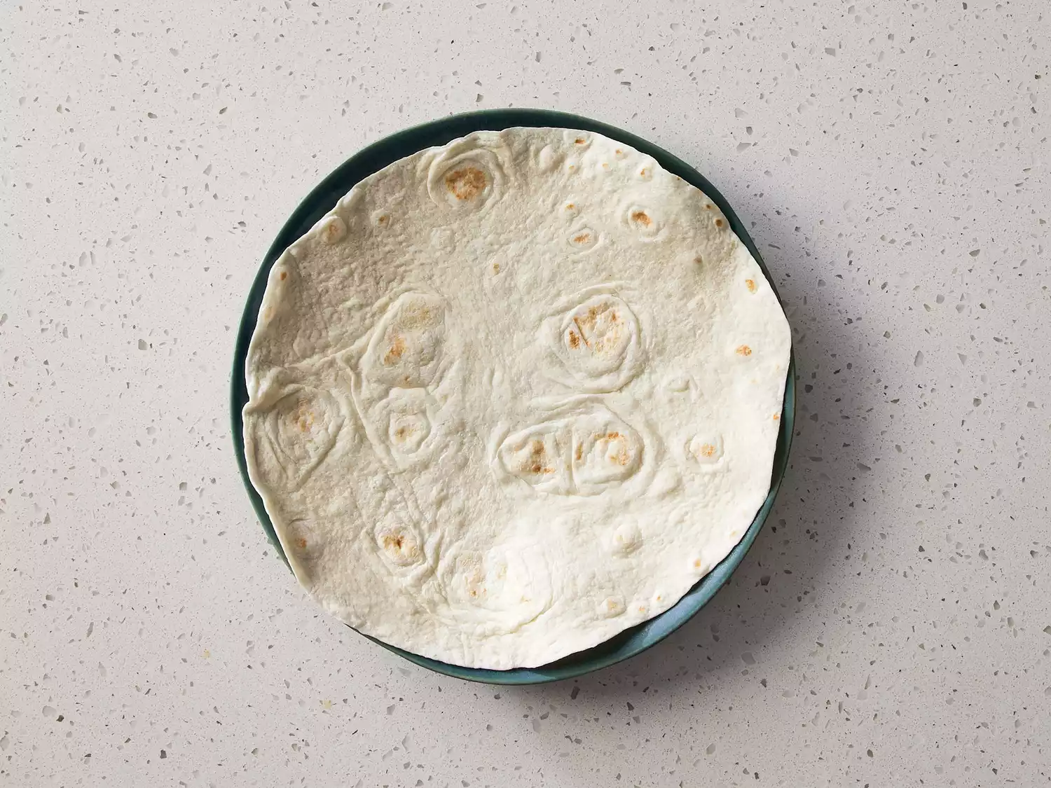 A flour tortilla on a plate