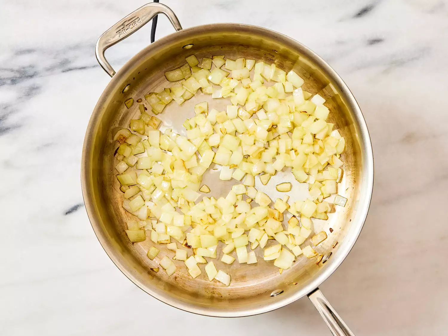 A large pan with chopped onion