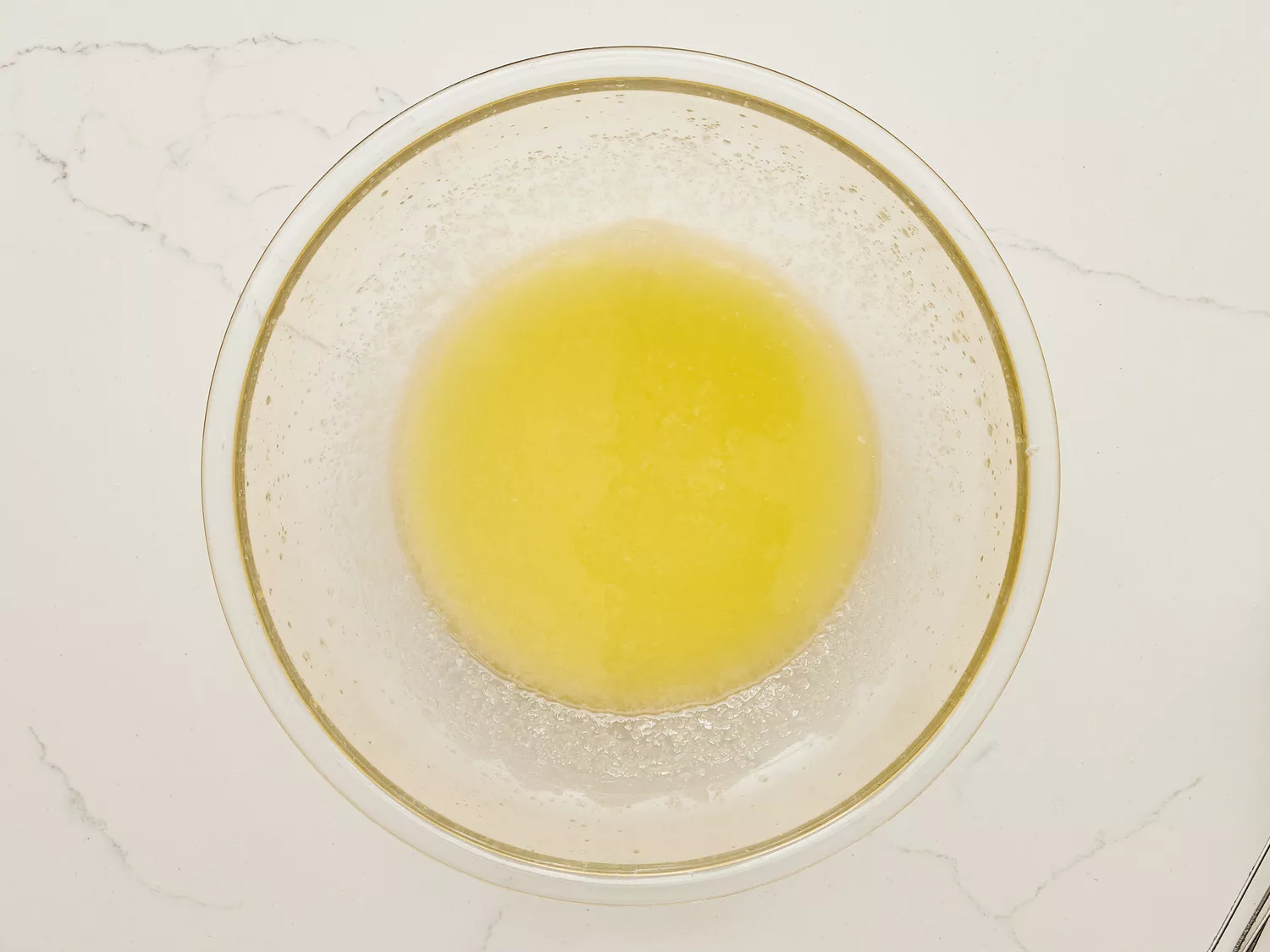 A bowl of melted butter and sugar