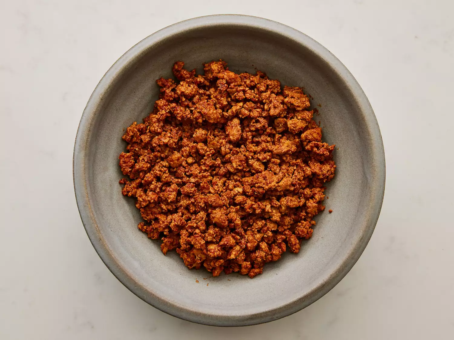 A serving bowl of ground turkey taco meat