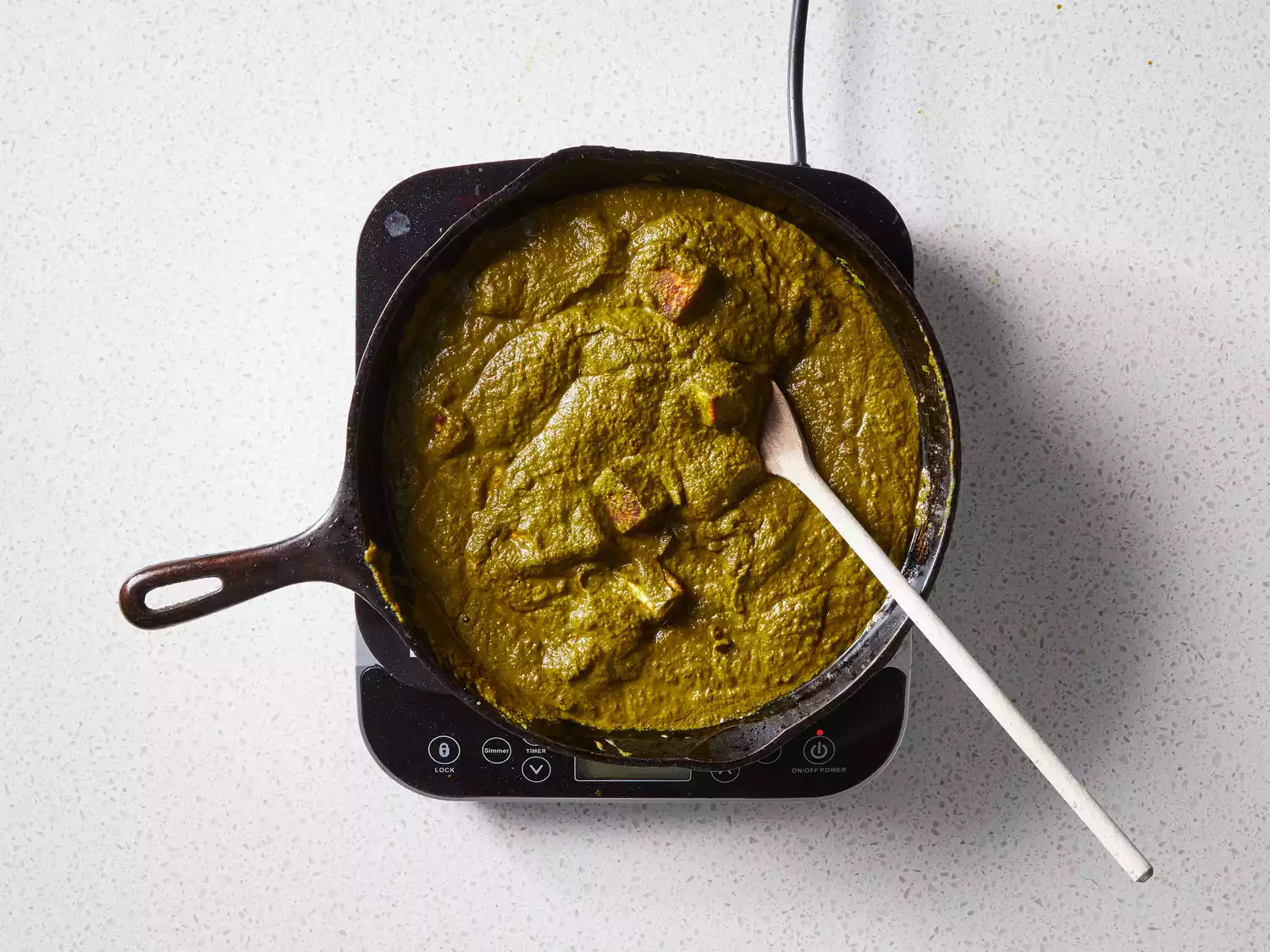 A skillet of palak paneer